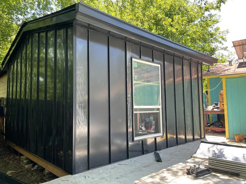 Black standing seam metal wall panels for Roof Inspection in Pepperell