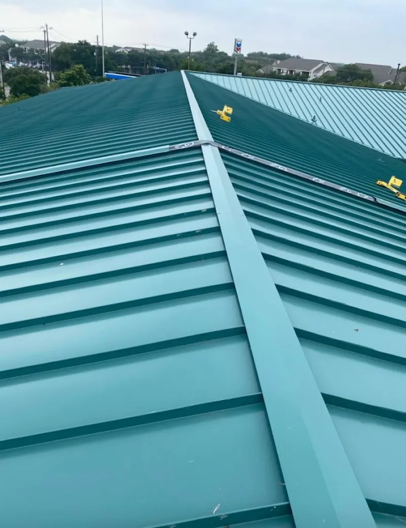 Green commercial metal roof ridge and valley for Metal Roof Repair in Pepperell